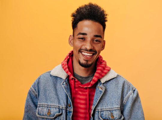 african-american-man-in-denim-jacket-smiling-on-or-2021-09-02-23-59-28-utc.jpg